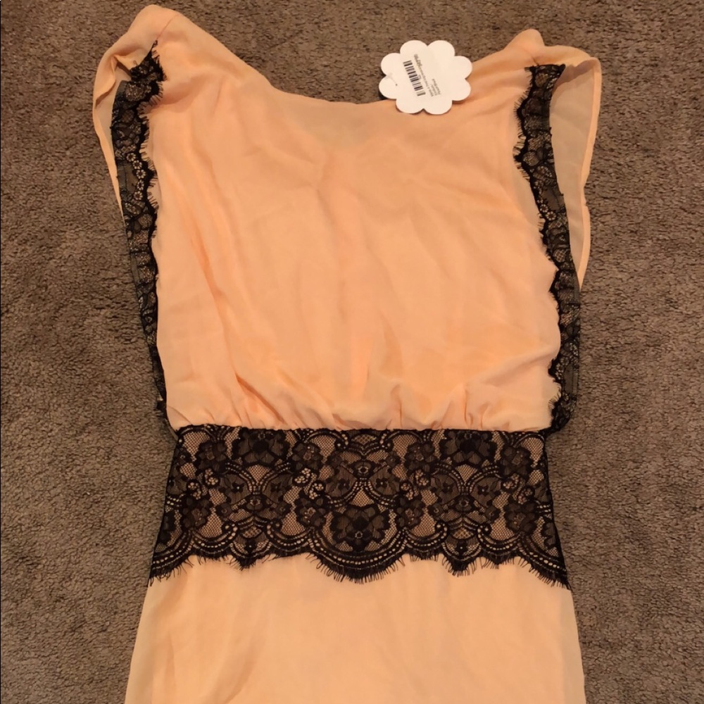 Hope’s boutique peach and black dress